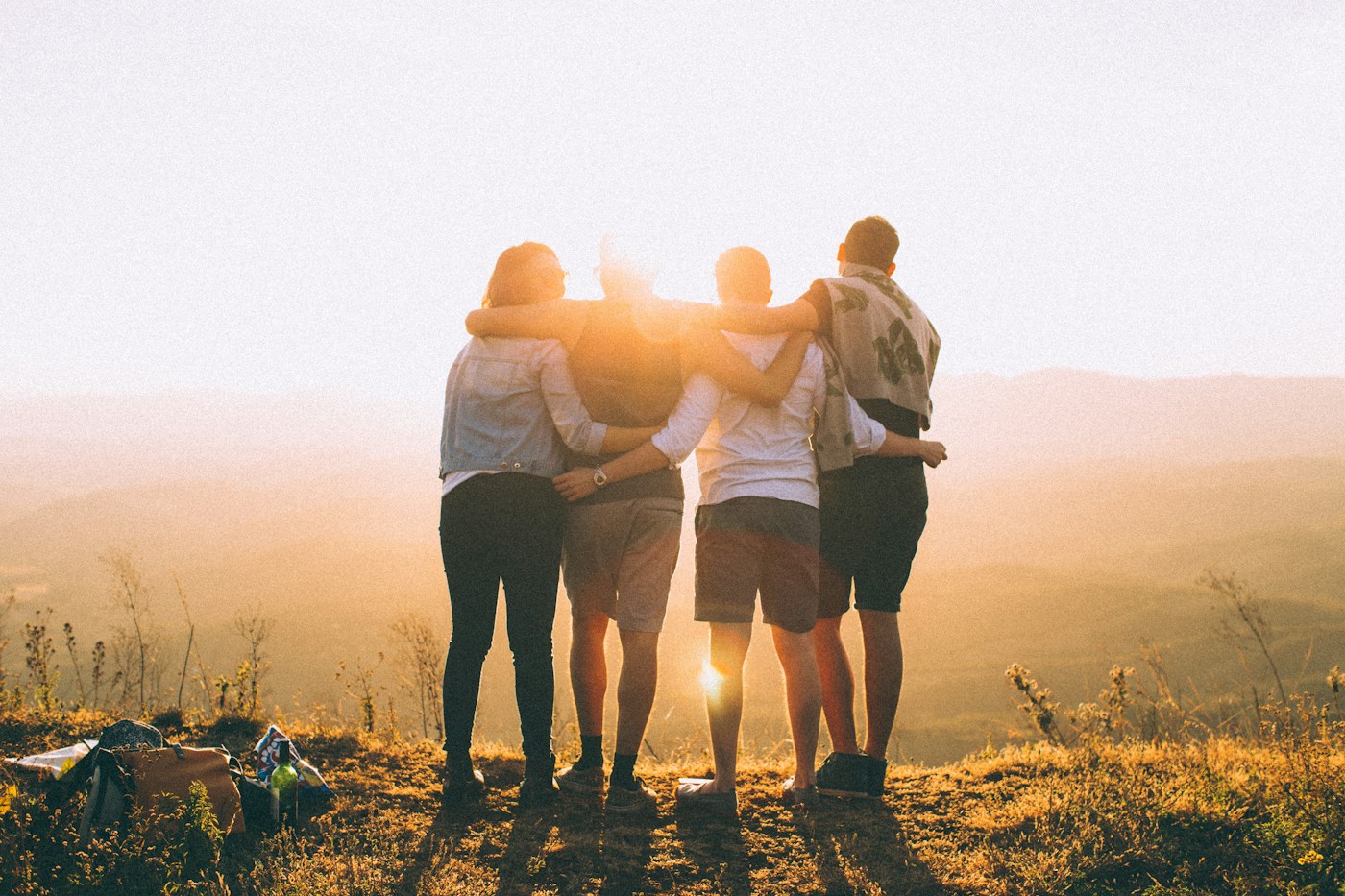 Friends enjoying a golden sunset together